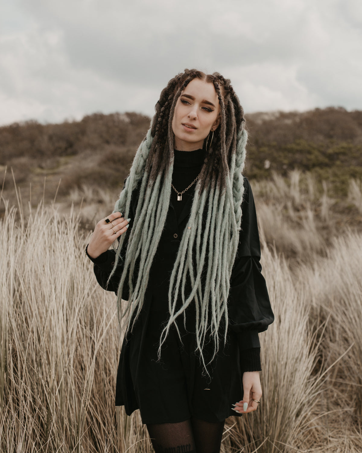 Emitsem wearing the set minty in bum length while walking through the grass