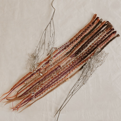 A set of handmade bohemian decorated dreadlock extensions Locks of Love in different colors, pink lavender purple and dark brown caramel tones