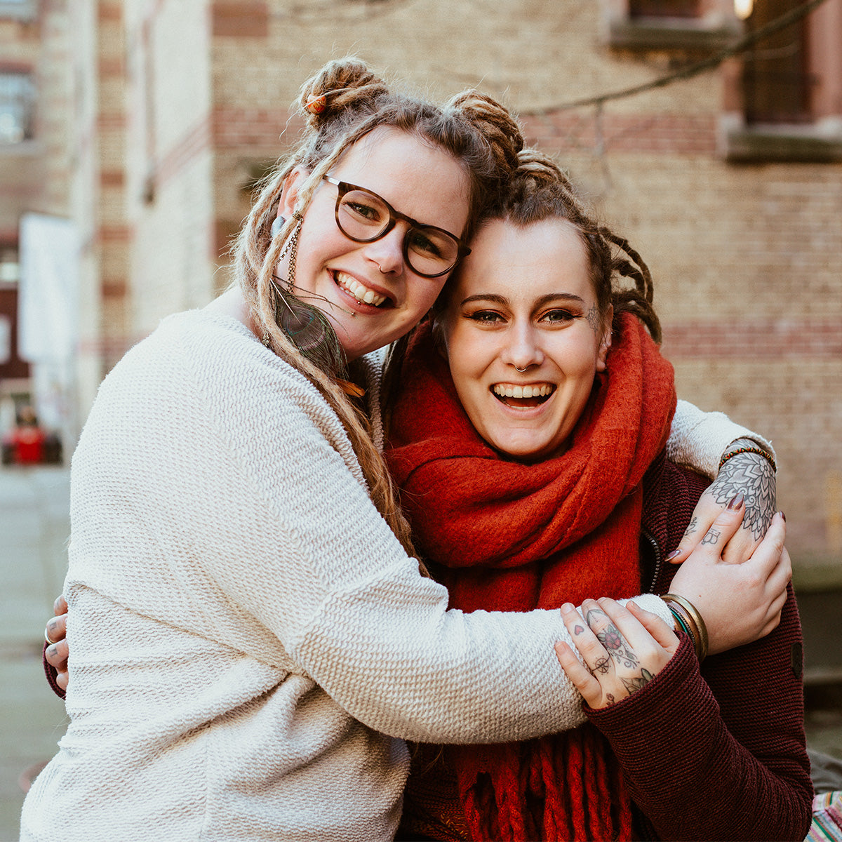 two friends laughing, both with gorgeous real locks