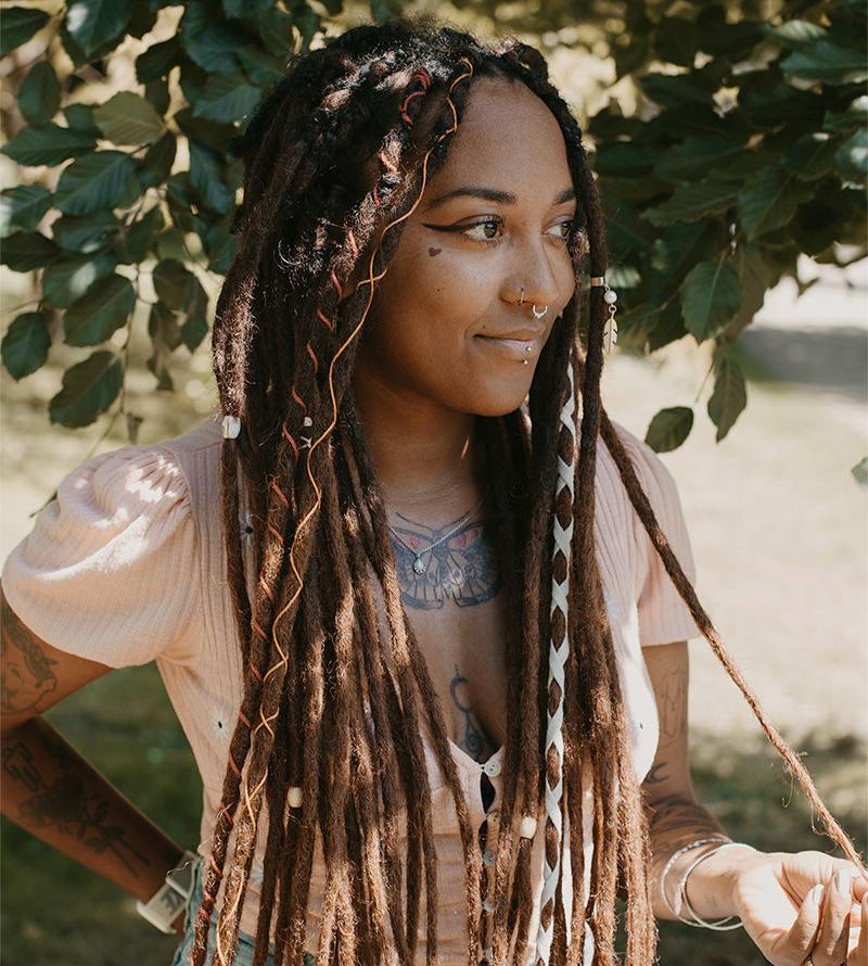 Model wearing high quality synthetic dreadlocks from Dreadshop, oaky color