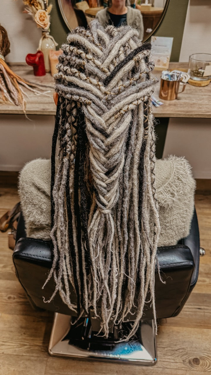 Back view of a customer from Dreadshop Salon with Gray, Black and White Dreadlock Extensions installed | Locks of Love