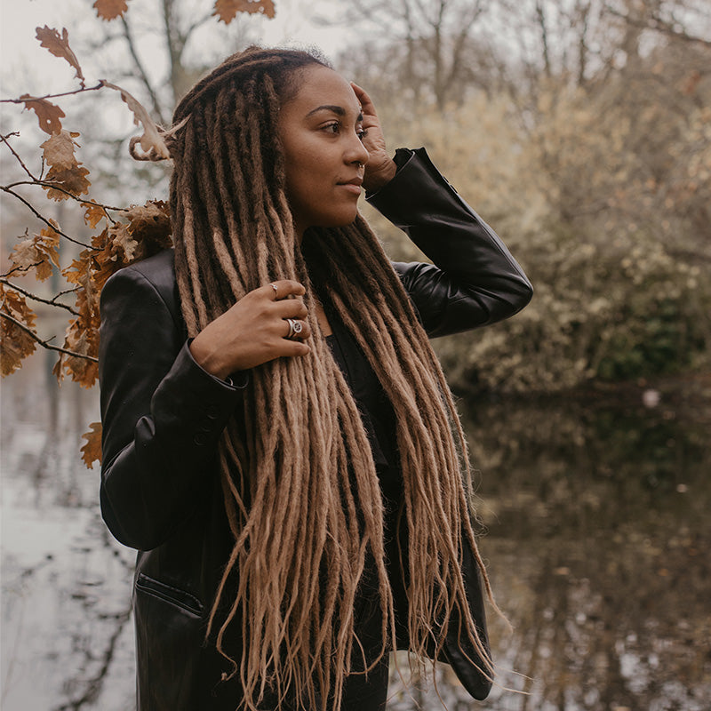 Model wearing high quality dreadlocks from Dreadshop, Locks of Love, caramel twist color