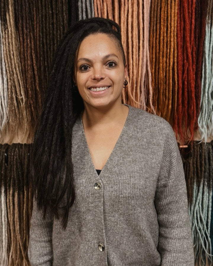 Front view of Dreadshop Salon customer with real dreadlocks and shaved sides