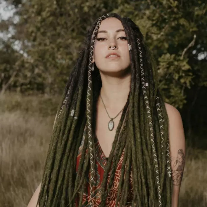 Romy in the forest wearing the dreadset Mossy in Bum length, Dreadset Locks of Love Shop the look, dreadset full head, Dreadset original locks of love