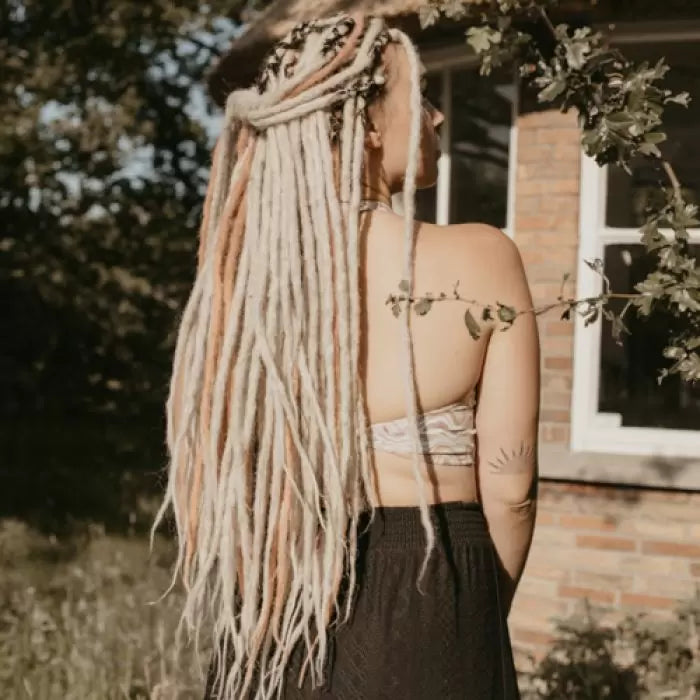 Romy from the back wearing the dreadset Hidden rusty in Bum length, Dreadset Locks of Love Shop the look, dreadset full head, Dreadset original locks of love