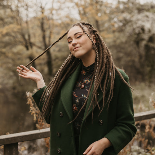 Romy wearing the dreadset Dark chocolate in Back length, Dreadset Locks of Love Shop the look, dreadset full head, Dreadset original locks of love