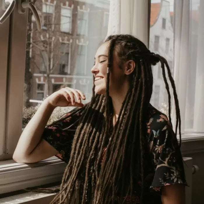 Romy wearing the dreadset Dark chocolate in Bum length, Dreadset Locks of Love Shop the look, dreadset full head, Dreadset original locks of love