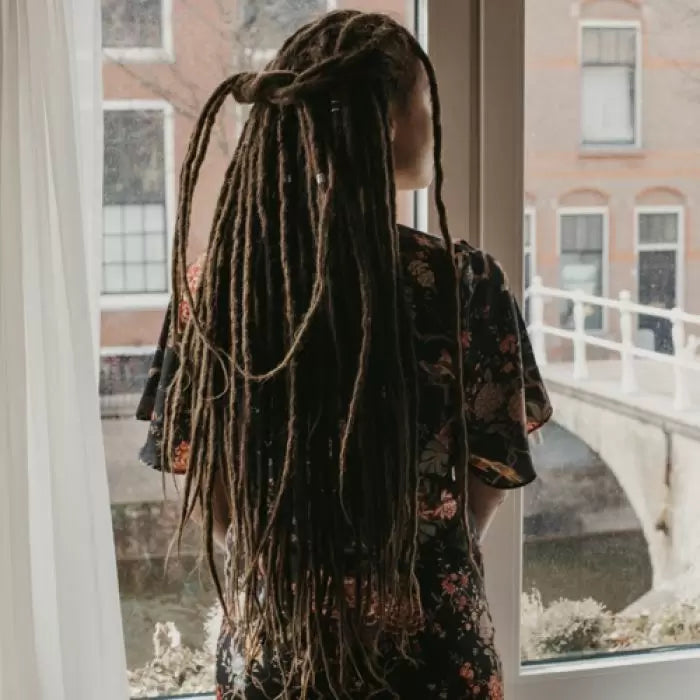 Romy from the back and she is wearing the dreadset Dark chocolate in Bum length, Dreadset Locks of Love Shop the look, dreadset full head, Dreadset original locks of love