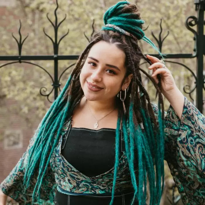 Romy wearing the dreadset Wild ocean in Back  length, Dreadset Locks of Love Shop the look, dreadset full head, Dreadset original locks of love