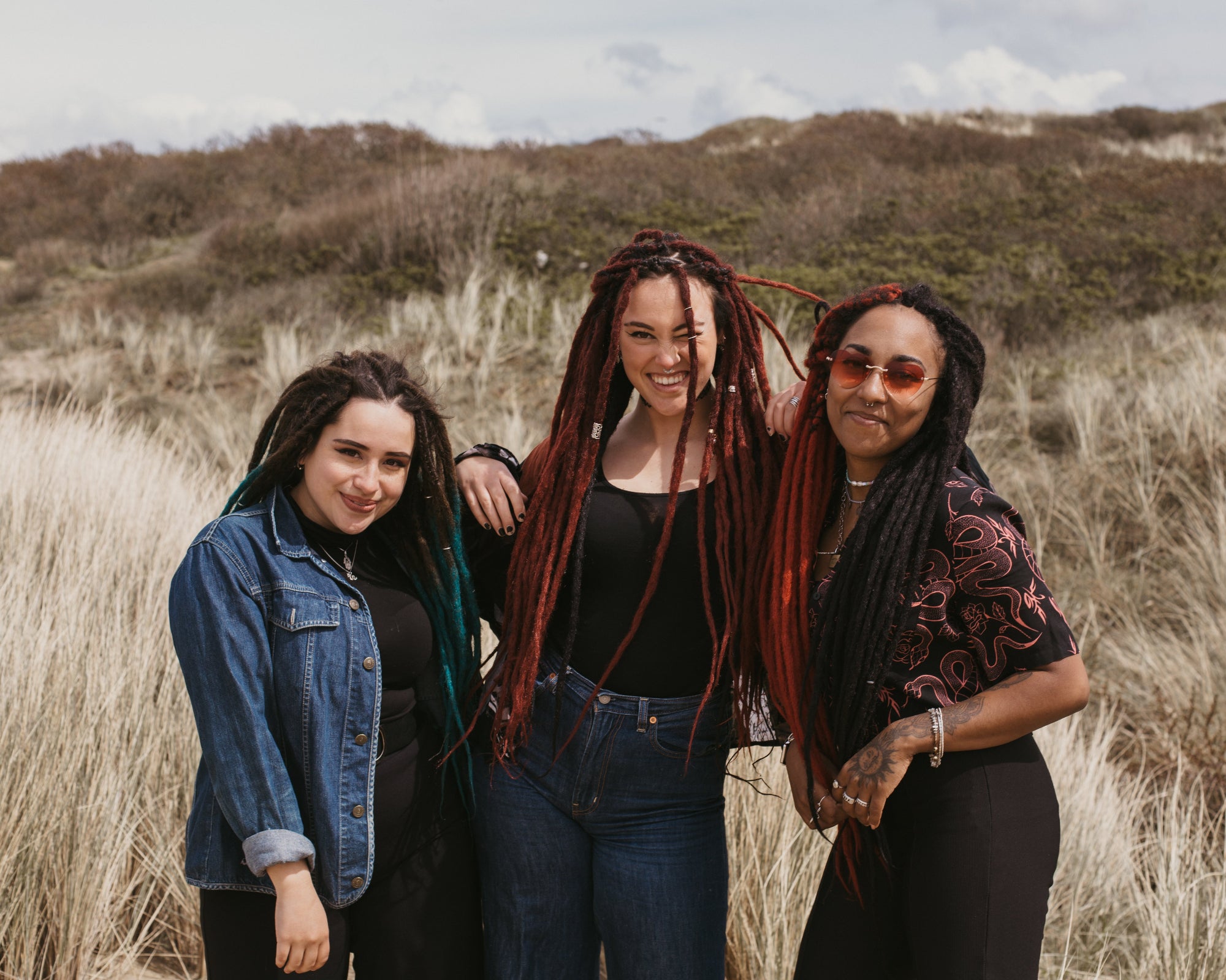 3 models laughing at the camera all wearing a different Locks of Love set