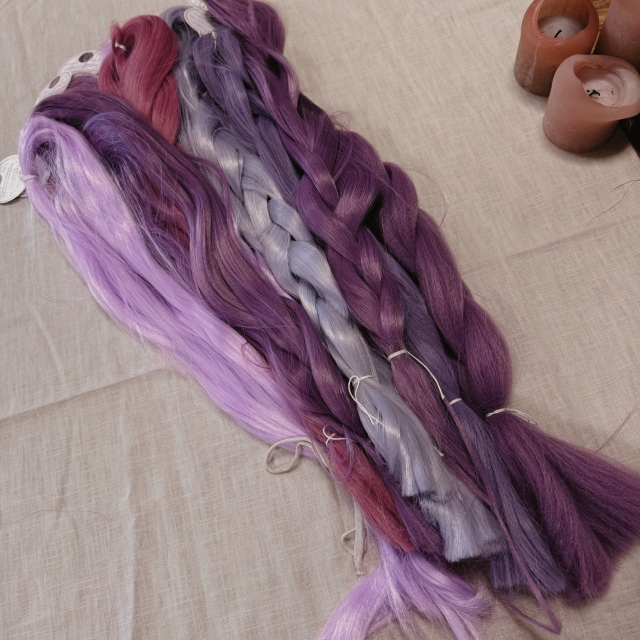 Purple toned Synthetic Hair Braids in Bulk. Henlon Hair braids from Dreadshop warehouse, tangled and fluffy. 