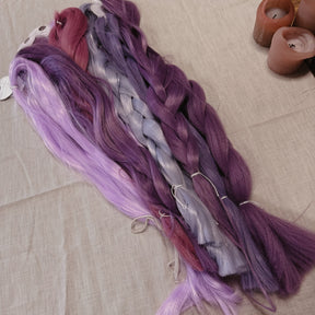 Purple toned Synthetic Hair Braids in Bulk. Henlon Hair braids from Dreadshop warehouse, tangled and fluffy. 