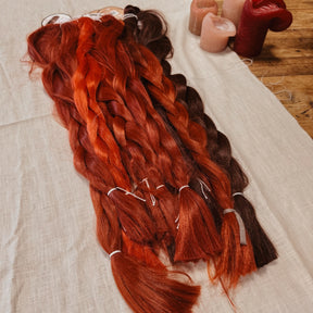 Red tones Synthetic Hair Braids in Bulk. Henlon Hair braids from Dreadshop warehouse, tangled and fluffy. 