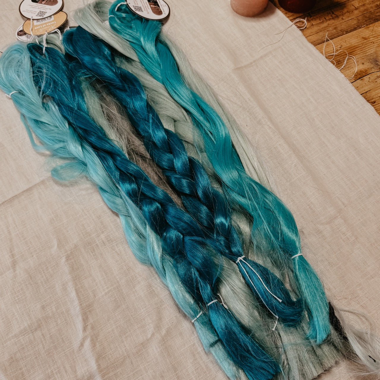 Turquoise Synthetic Hair Braids in Bulk. Henlon Hair braids from Dreadshop warehouse, tangled and fluffy. 