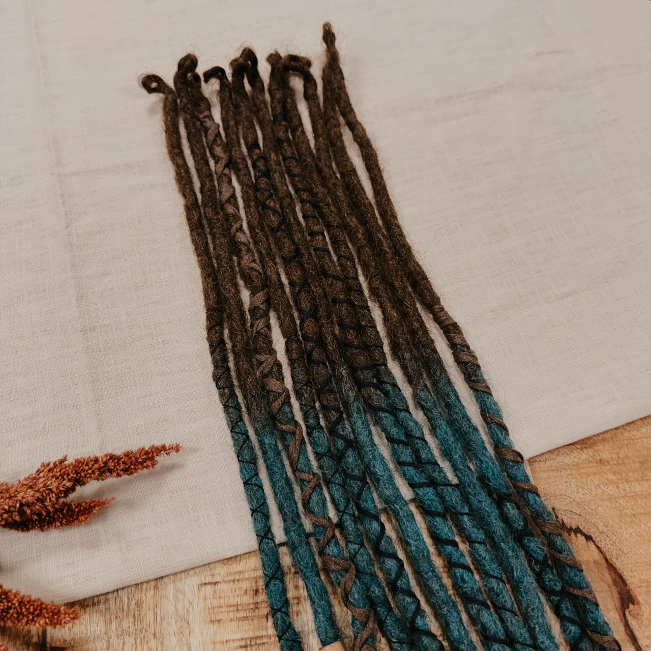 Blue turquoise brown Decorated Set of Dreadlock Extensions. Great for Partial style or to be added to real Dreads. Picture is showing the top of the set with close up on decorations, beads and yarn in brown tones.