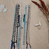 Decorated Dreadlock Extensions: ash blonde, white silver dreads with blue and gray decorations. Accent Set from Dreadshop. 