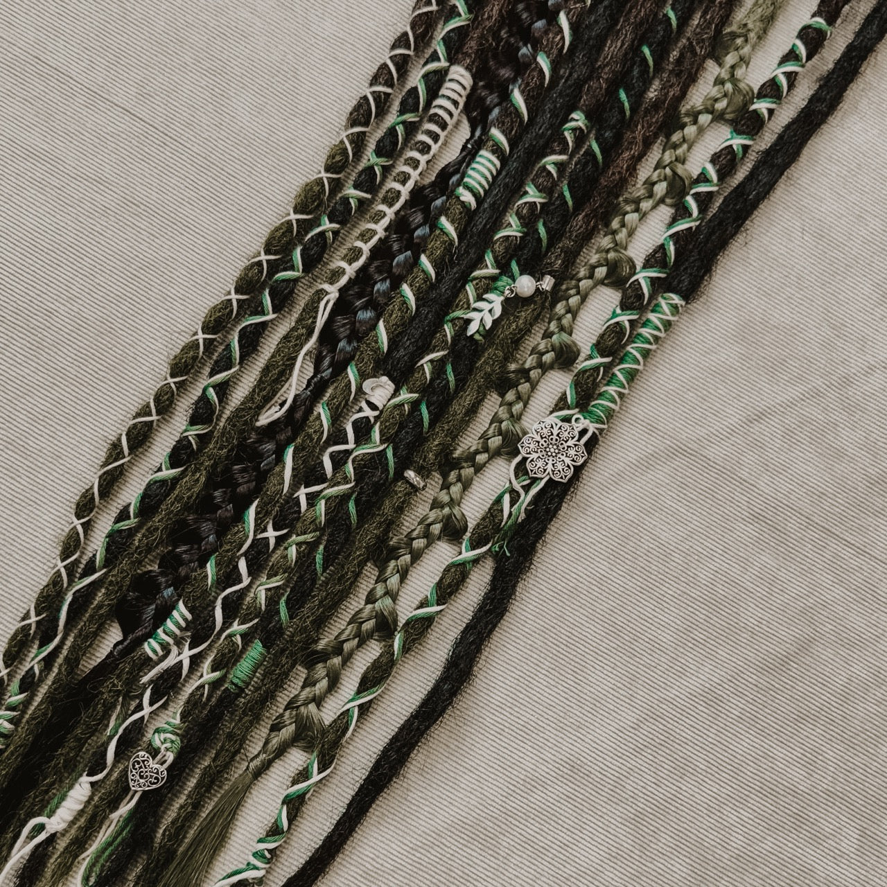 Decorated Dreadlock Extensions: black and green mix, ombre dreads with decorations. Accent Set from Dreadshop. 