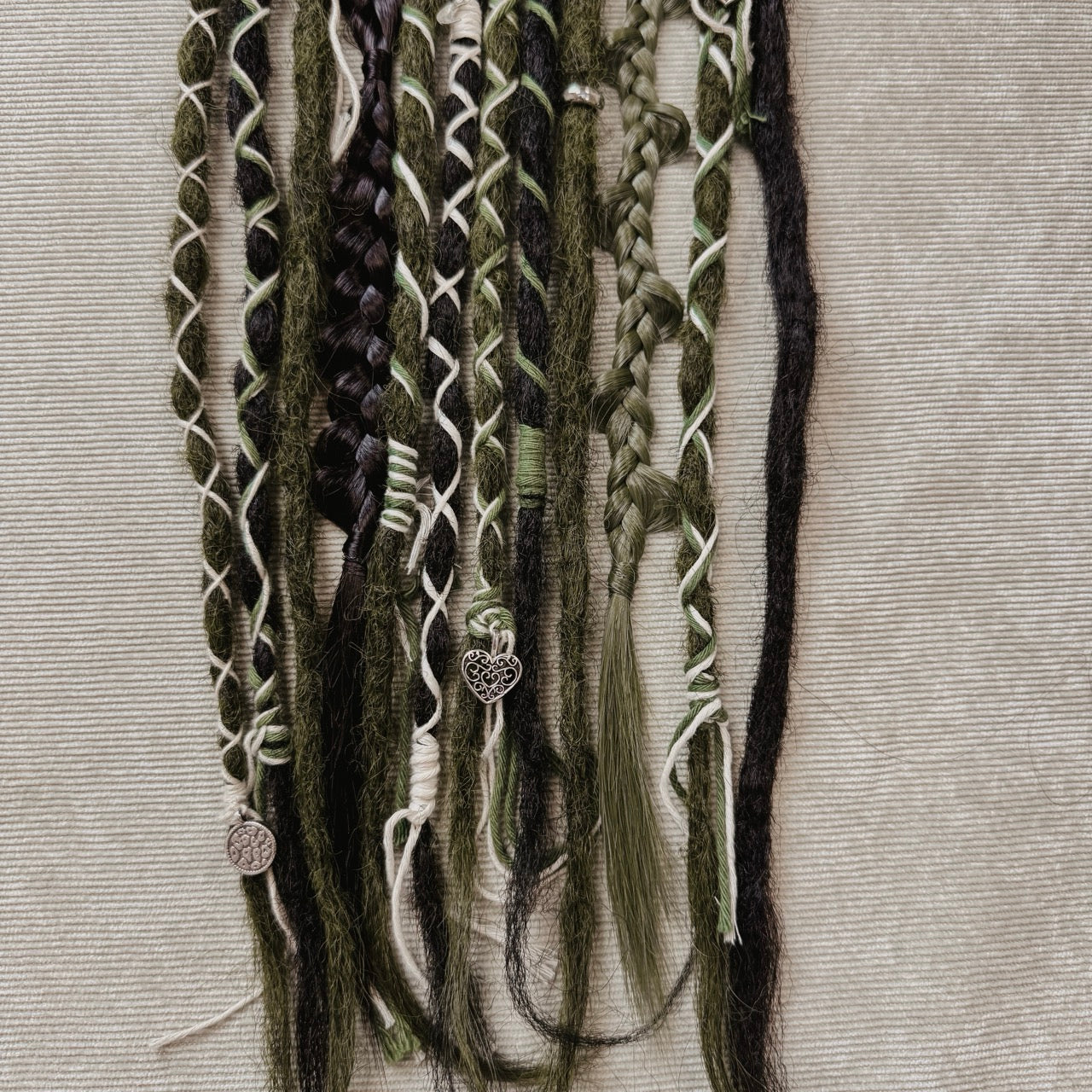 Decorated Dreadlock Extensions: black and mossy mix, ombre dreads with decorations. Accent Set from Dreadshop. Close up on the ends