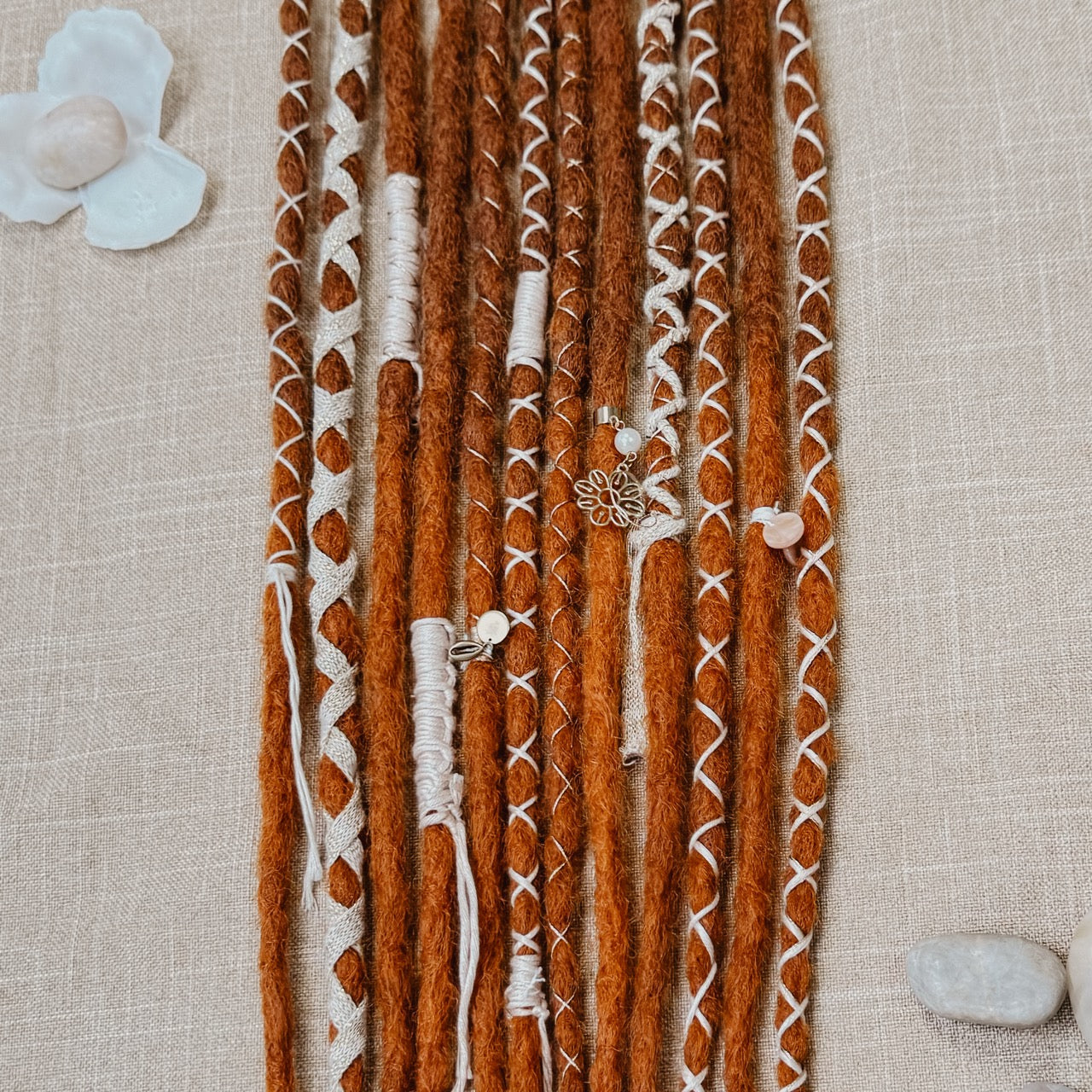 Decorated Dreadlock Extensions: ginger ombre dreads with decorations. Accent Set from Dreadshop. Close up on the middle