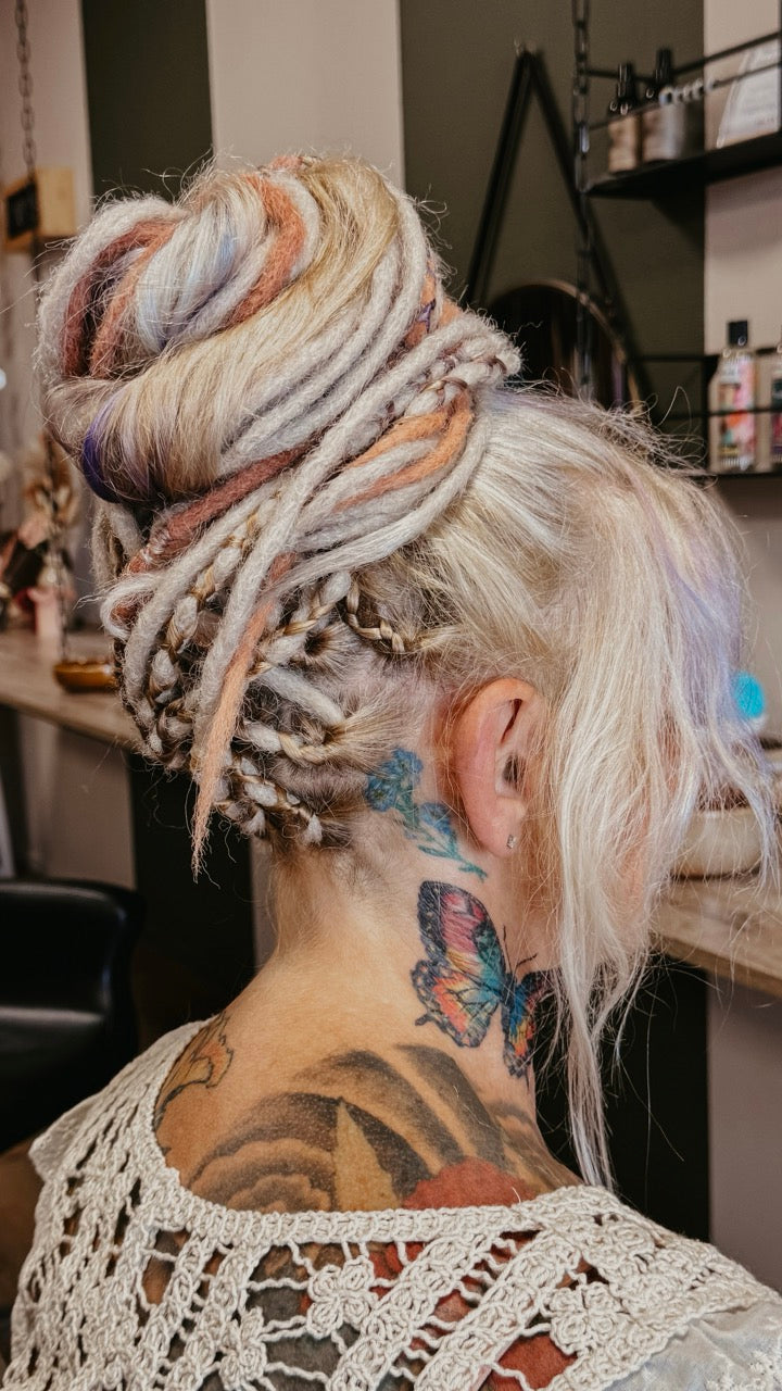 Back view of a customer from Dreadshop Salon with Partial Dreadlock Extensions installed 