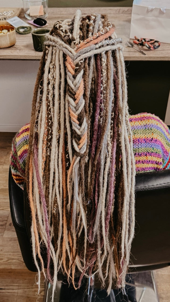 Back view of a customer from Dreadshop Salon with colorful Dreadlock Extensions installed 