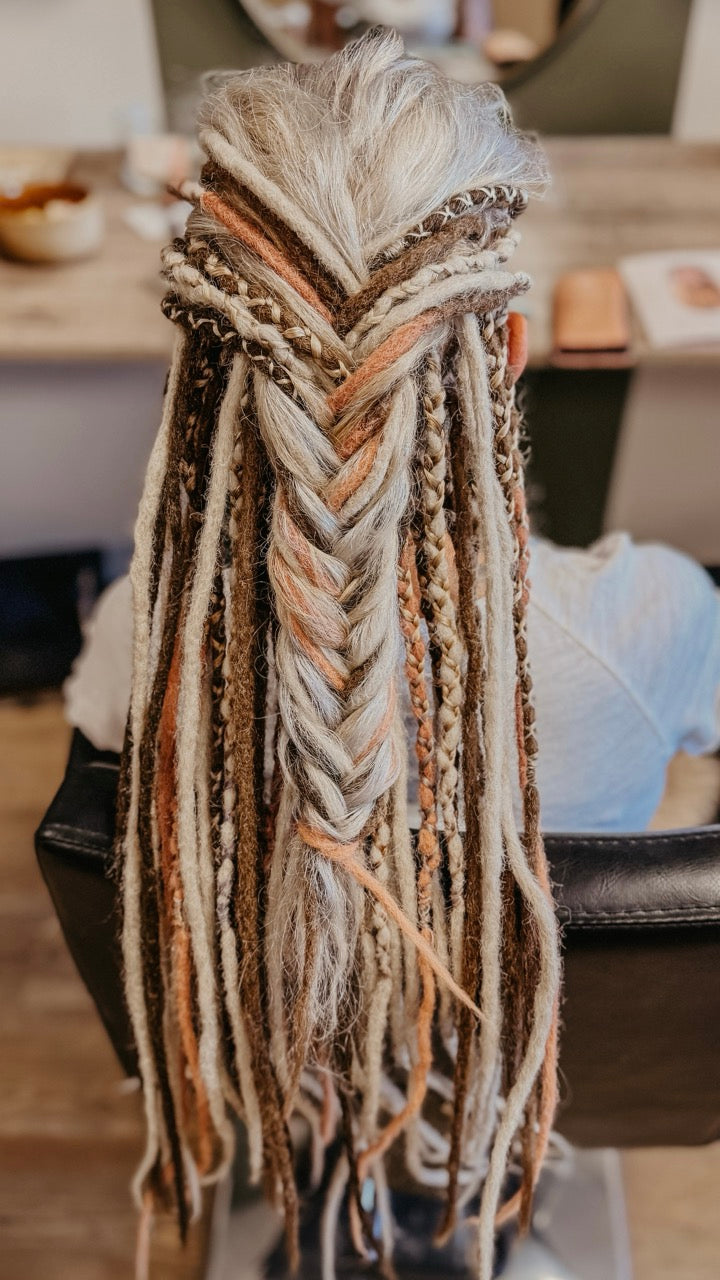 Back view of a customer from Dreadshop Salon with colorful Partial Dreadlock Extensions installed 