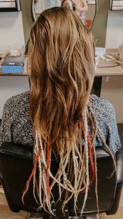 Partially braided dreadlock extensions. Dreadshop Salon customer. Brown, blonde and red dreadlocks