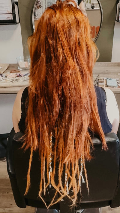 Partially braided dreadlock extensions. Dreadshop Salon customer. Ginger hair with ginger dreadlocks, decorated