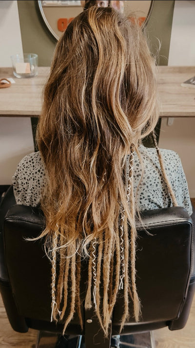 Partially braided dreadlock extensions. Dreadshop Salon customer. Brown dreadlock extensions