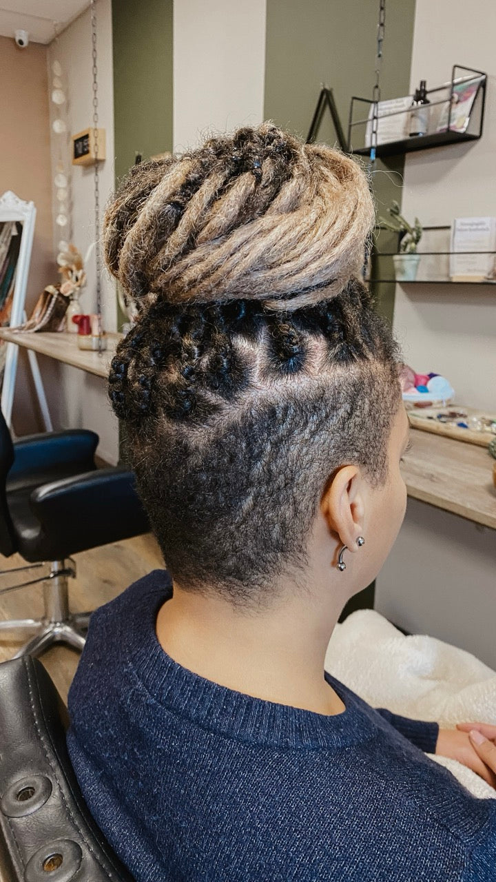 Dreadshop Salon customer with partial dreadlock extensions in natural colors with shaved sides