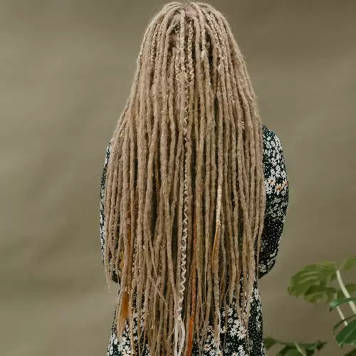 Renate wearing her Dark blonde Renate's locks of love dreadlocks with the accent set golden blush as partial dreads
