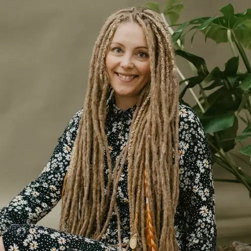 Renate wearing her Dark blonde Renate's locks of love dreadlocks with the accent set golden blush as partial dreads