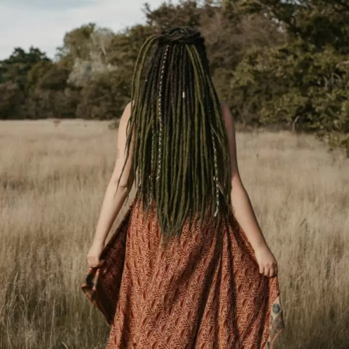 Romy in the forest wearing the dreadset Mossy in Bum length, Dreadset Locks of Love Shop the look, dreadset full head, Dreadset original locks of love